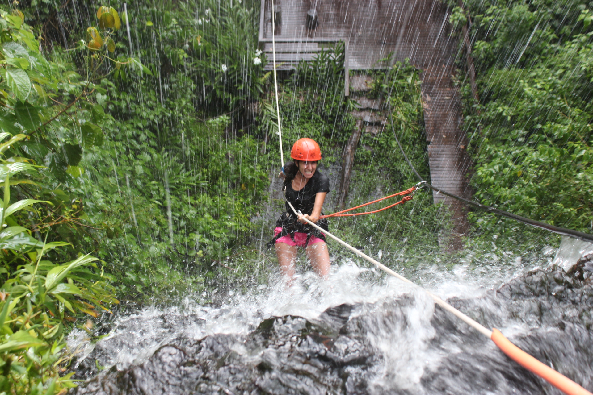 Rappelling through a waterfall